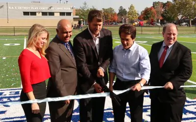 Ribbon cutting on field